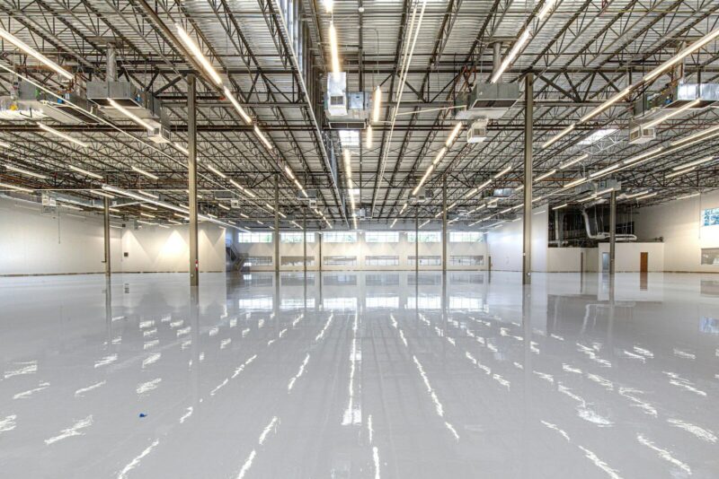 Shiny warehouse floor with overhead lights and ceiling danville ca